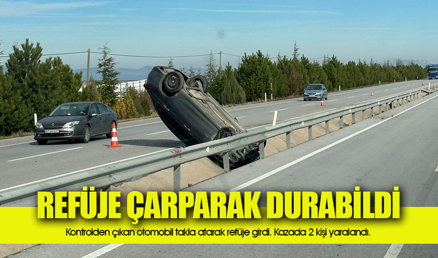 Takla atıp refüje giren otomobilde 2 kişi yaralandı