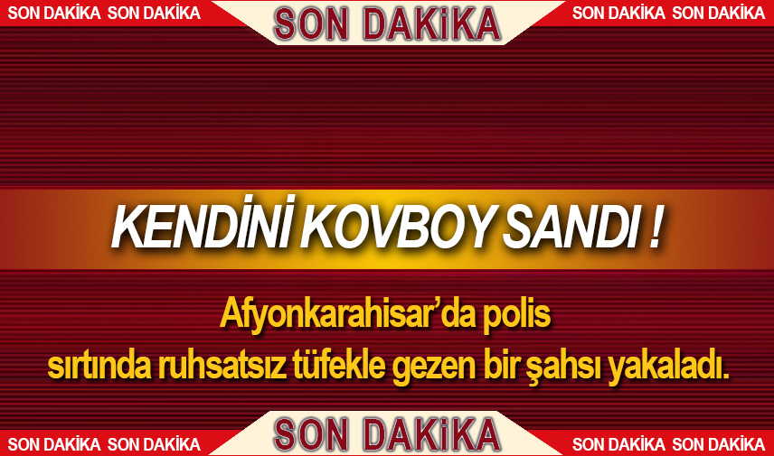 Sırtında tüfekle gezerken polise yakalandı